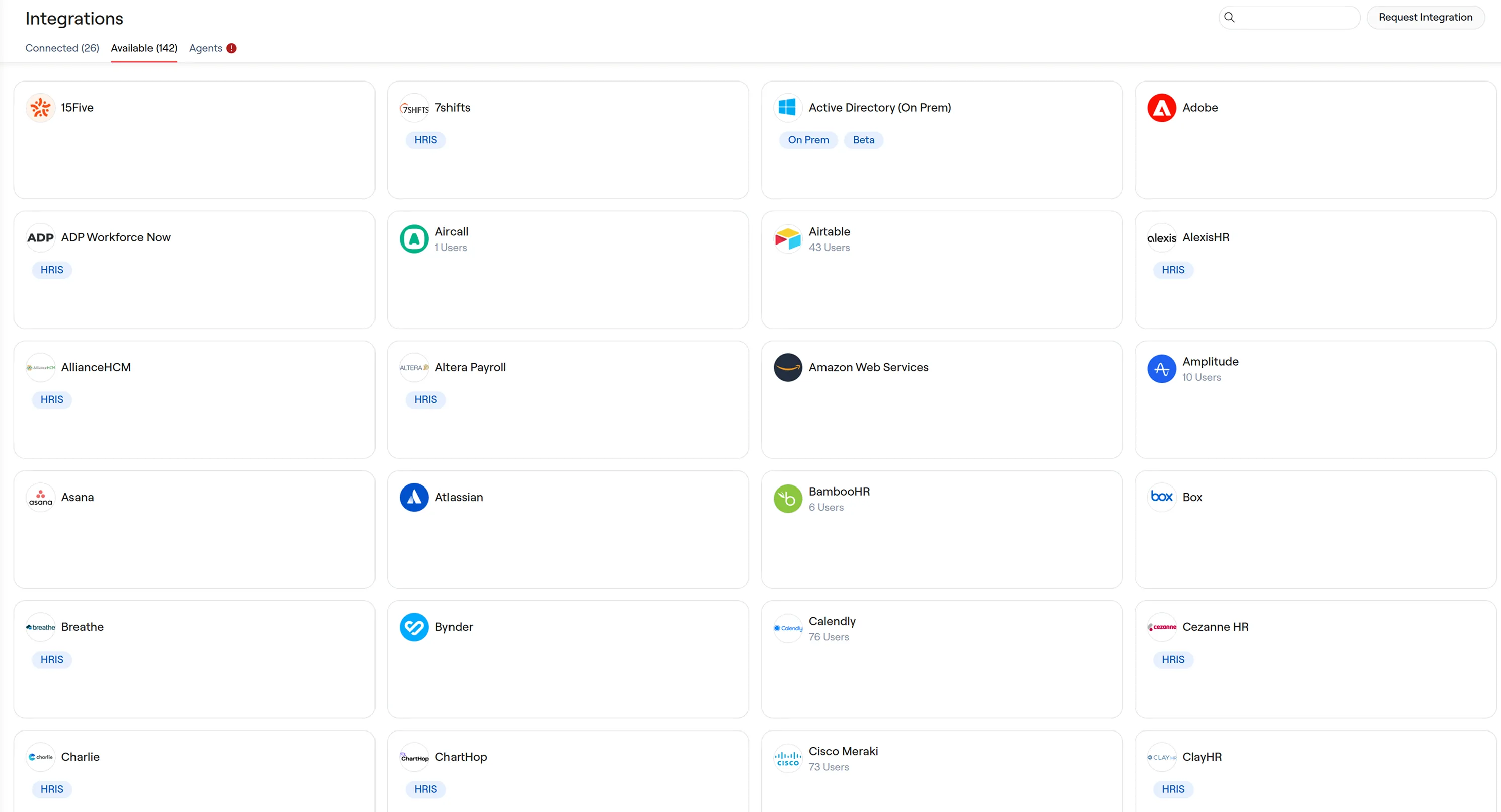 The old Integrations page as a card grid, on the Available (142) tab. Each card carries only a logo, a name, an optional HRIS or On Prem tag and a user count, so most of the card is empty space.